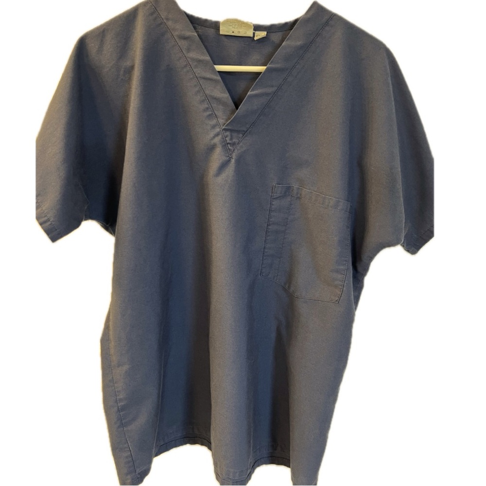 Scrub Zone navy blue vee neck scrub top.  Vest pocket. Size small.